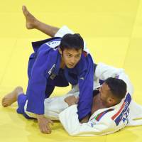 Naohisa Takato competes against Azerbaijan\'s Orkhan Safarov in the 60-kg final at the World Judo Championships in Budapest on Monday. Takato won by ippon. | AFP-JIJI