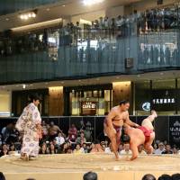Takanoiwa throws Daieisho to the ground at the JP Tower on Sunday. | KAZ NAGATSUKA
