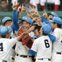 Hanasaki Tokuharu celebrates after winning the National High School Baseball Championship title on Wednesday at Koshien Stadium in Nishinomiya, Hyogo Prefecture. | KYODO
