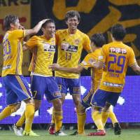 Vegalta\'s Hiroaki Okuno (7) celebrates with his teammates after scoring against Antlers during their Levain Cup match on Wednesday in Sendai. | KYODO
