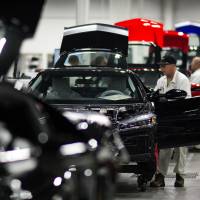Honda workers assemble cars at the company\'s Marysville plant in Ohio. The carmaker is investing &#36;267 million and adding 300 jobs at two Ohio factories. | BLOOMBERG