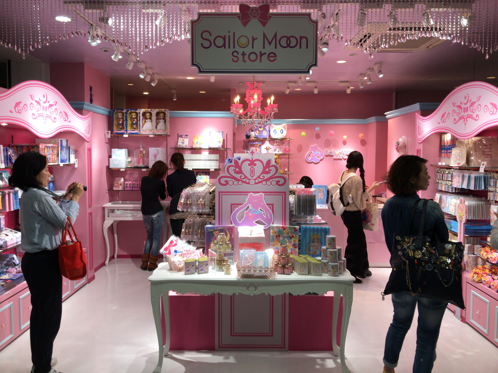 People look at the new Sailor Moon store in Tokyo's trendy Harajuku district during a media preview Saturday morning. It opened to the public later in the day. | KAZUAKI NAGATA