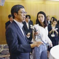 Japan\'s chief negotiator on the Trans-Pacific Partnership agreement, Kazuyoshi Umemoto, speaks to reporters on Friday in Tokyo. | KYODO