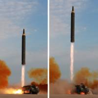 A North Korean Hwasong-12 intermediate-range missile is launched in this undated combination photo released Sept. 16. | KCNA / VIA REUTERS