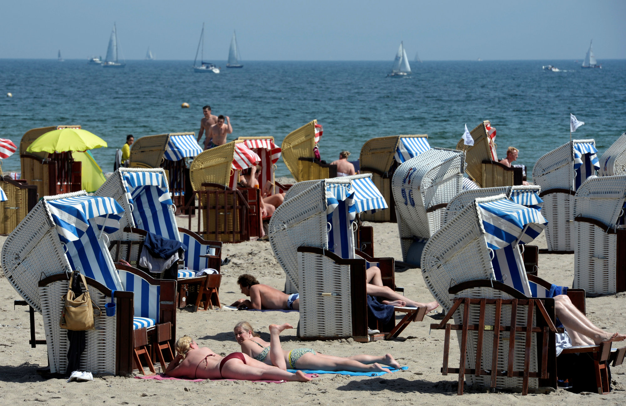People sunbathe at the Baltic Sea beach of Travemuende in this file photo. | REUTERS