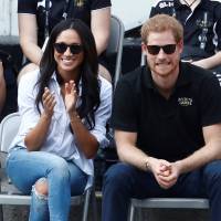 Britain\'s Prince Harry and his girlfriend, actress Meghan Markle, watch the wheelchair tennis event during the Invictus Games in Toronto Monday. | REUTERS