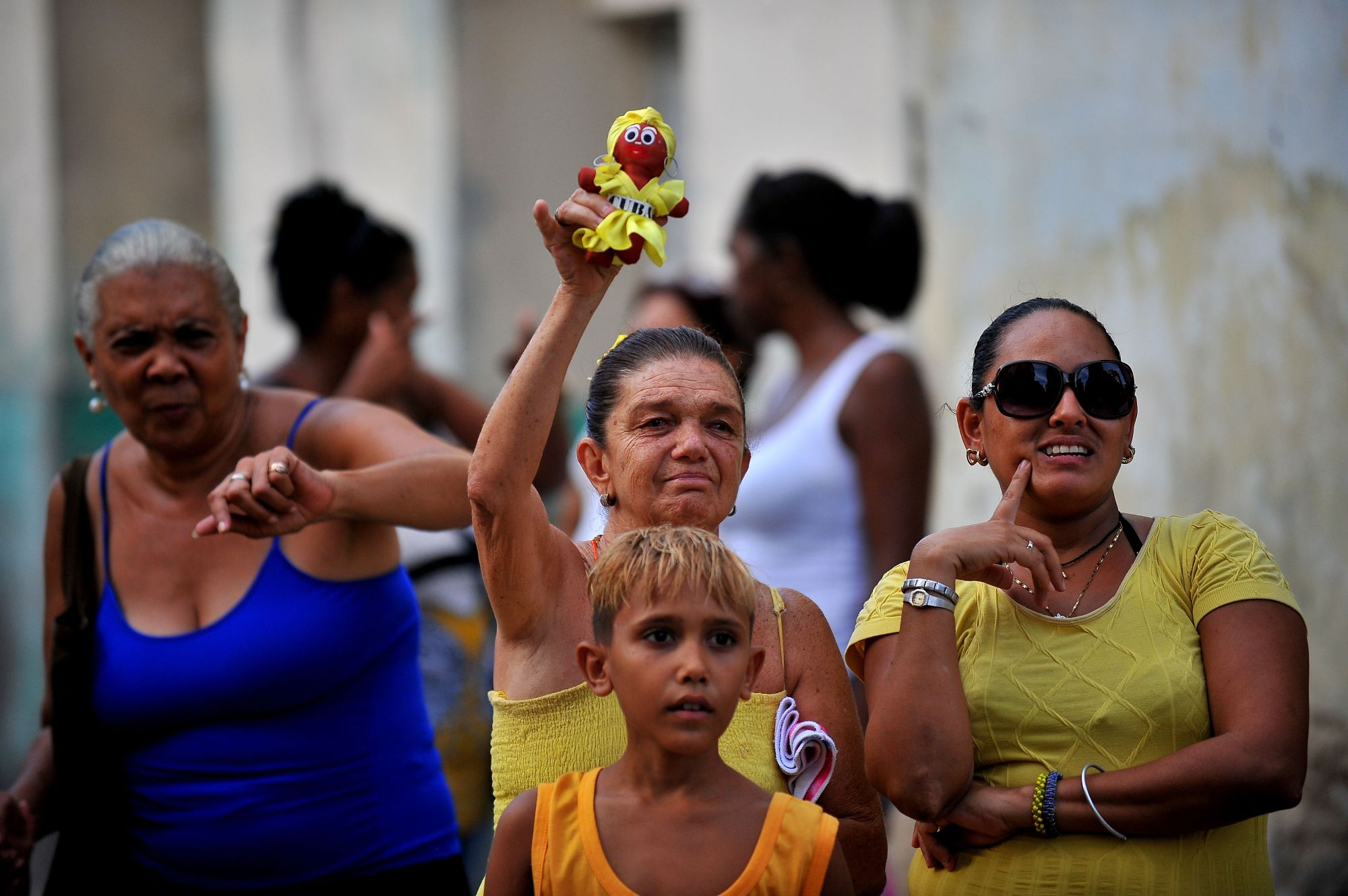 People accompany the procession to celebrate the day of Our Lady of Charity of El Cobre, patroness of Cuban peoples, in Havana on Friday. Cubans asked the virgin to protect them against Hurricane Irma. | AFP-JIJI