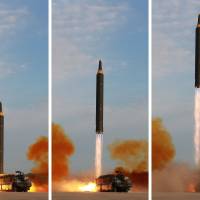 A North Korean Hwasong-12 intermediate-range ballistic missile is fired from a transporter erector launcher in these photos released Saturday. | REUTERS