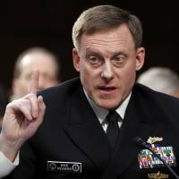 National Security Agency director Adm. Mike Rogers speaks during a Senate Intelligence Committee hearing in June about the Foreign Intelligence Surveillance Act on Capitol Hill in Washington. Intelligence and law enforcement officials across the government lobbied Congress on Monday to let them conduct broad surveillance on foreign targets in coming years, saying it helps prevent terrorist and cyberattacks on the United States. Rogers told senators earlier this year that a lot of what was in the intelligence agencies\' assessment on Russian meddling in the U.S. election was informed by knowledge gained through the Foreign Intelligence Surveillance Act. | AP
