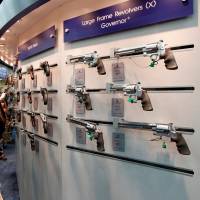 Gun enthusiasts look over Smith &amp; Wesson guns at the National Rifle Association\'s annual meetings and exhibits show in Louisville, Kentucky, in May 2016. | REUTERS