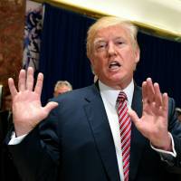 U.S. President Donald Trump speaks to the media about protests in Charlottesville, Virginia, in the lobby of Trump Tower in New York on Aug. 15. | AFP-JIJI