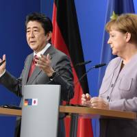 Prime Minister Shinzo Abe and German Chancellor Angela Merkel agreed on a tougher sanction against North Korea at a teleconference held Tuesday. | KYODO