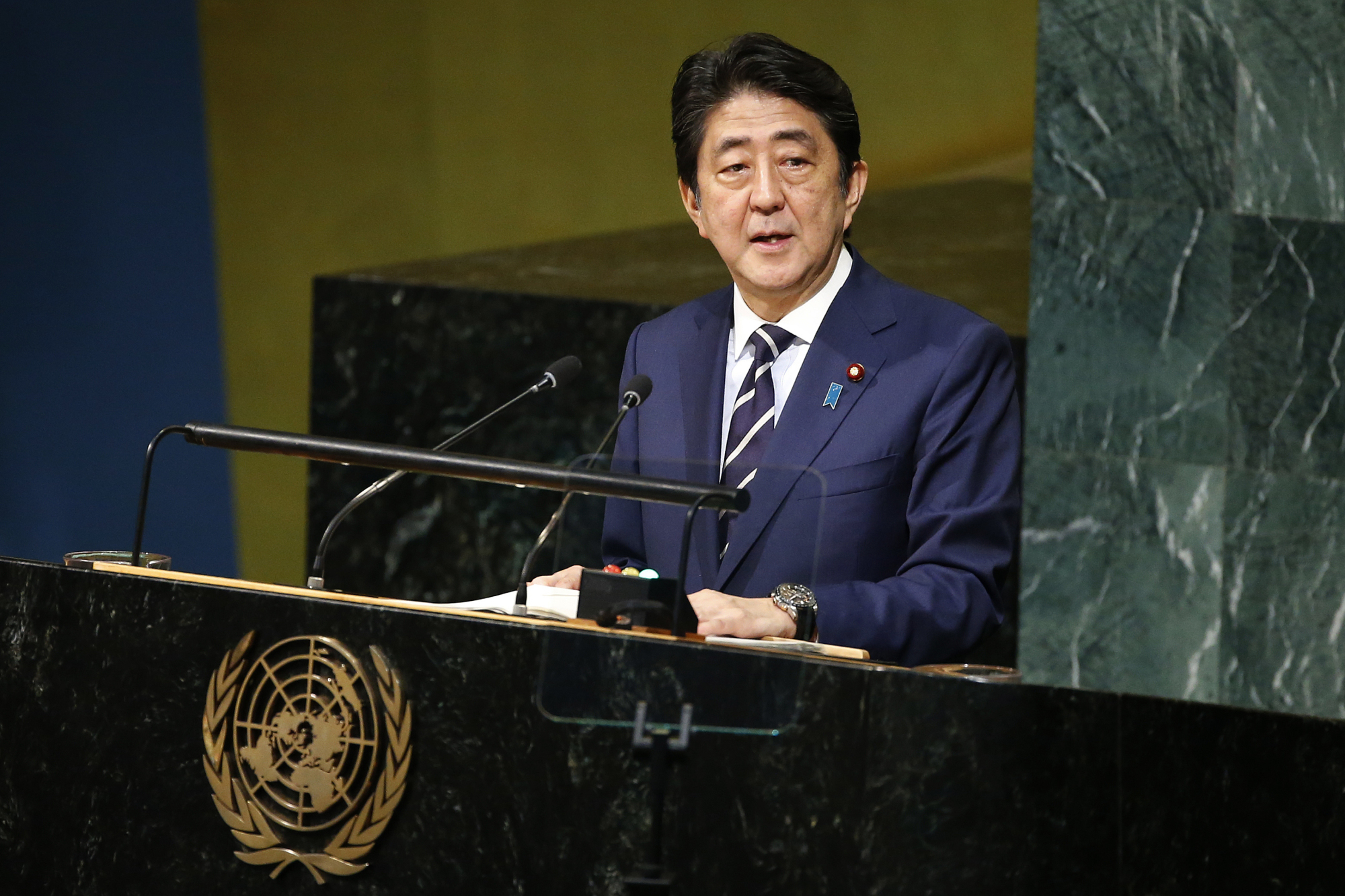 Prime Minister Shinzo Abe addresses the United Nations General Assembly at U.N. headquarters in New York Wednesday. | AP