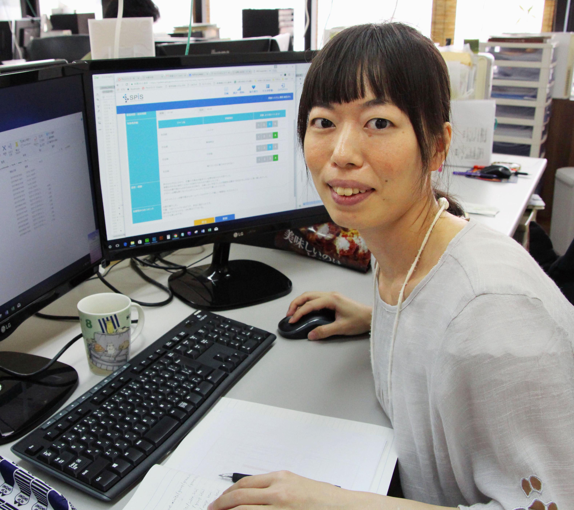 Risa Urata, who has a developmental disorder, explains a software program developed by her company, Okushin System, that monitors early symptoms of mental health issues, on Aug. 4 in Osaka. | KYODO