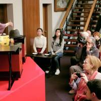 Tourists watch a tea ceremony in Kyoto, one of the most popular destinations in Japan. | KYODO