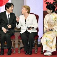 Prince Akishino speaks with Chilean President Michelle Bachelet as Princess Kiko looks on, at a ceremony commemorating the 120th anniversary of diplomatic ties between the two countries in Santiago on Wednesday. | KYODO