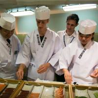 Hands-on lesson: A Culinary Institute of America student makes nigiri sushi at Tsukiji Tamasushi in Tokyo. | COURTESY OF SUNTORY HOLDINGS LTD