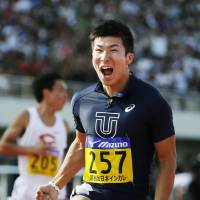A Japan first: Yoshihide Kiryu is elated after breaking a track-and-field record. | KYODO
