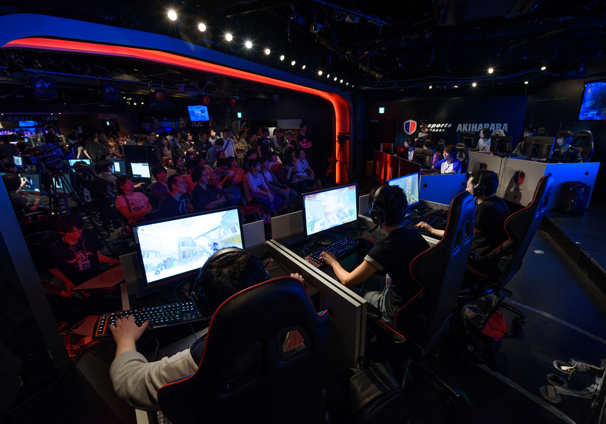 Attendees play Activision Blizzard Inc.'s Overwatch game at the AOC Open e-Sports event in Tokyo on July 1. Japan has been slow to embrace e-sports, but that may change. | BLOOMBERG