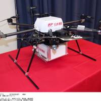 Drone delivery: This photo shows a drone Japan Post Co. is considering using to transport packages between post offices. | KYODO