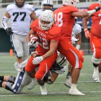 Running back Yuki Shirakami breaks a Silver Star tackle during the first quarter of their X League game on Sunday at Fujitsu Stadium Kawasaki. | HIROSHI IKEZAWA