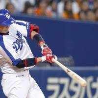 Yusuke Matsui bashes a two-run homer in the third inning on Tuesday against the Giants at Nagoya Dome. Chunichi defeated Yomiuri 10-2. | KYODO
