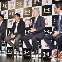 NCAA president Mark Emmert speaks during a panel discussion on Japan\'s planned college sports governing body with University of Tsukuba associate professor Tsuyoshi Matsumoto (far left), Dome Corporation CEO Shuichi Yasuda (second from the left) and Temple University professor Jeremy Jordan on Wednesday in Tokyo. | KAZ NAGATSUKA