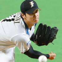 Shohei Otani pitches during the Fighters\' 7-0 win over the Eagles on Tuesday night. | KYODO