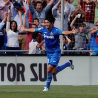 Getafe\'s Gaku Shibasaki celebrates after scoring the opening goal of his club\'s match against Barcelona on Saturday. Barcelona won 2-1. | REUTERS