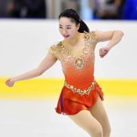 Wakaba Higuchi performs in the short program at the Lombardia Trophy on Thursday. Higuchi leads heading into Friday\'s free skate with a personal-best total of 74.26 points. | KYODO