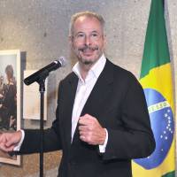 Brazilian Ambassador Andre Aranha Correa do Lago speaks at the opening of an exhibition titled \"Strengthening Eternal Bonds: 50 Years of the First Visit to Brazil of Their Majesties the Emperor and Empress of Japan\" at the Brazilian Embassy on Sept. 7. The exhibition runs through Oct. 6. | YOSHIAKI MIURA