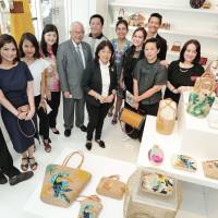 Philippines Ambassador Jose C. Laurel V (fifth from left) poses for a photo during the opening ceremony of the Philippine Design Exhibition at Good Design Marunouchi on Sept. 11. The event runs through Sept. 24. | YOSHIAKI MIURA