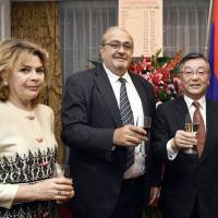 Armenian Ambassador Grant Pogosyan (center) and his wife, Natalia, pose for a photo with Yasumine Satake, president of the Japan-Armenia Business and Culture Initiative, during a reception to celebrate the 26th anniversary of Armenia\'s independence at Hotel Okura, Tokyo on Sept. 21. | YOSHIAKI MIURA