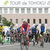 Participants taking part in the Tour de Tohoku 2017 leave the starting line in Ishinomaki, Miyagi Prefeture, on Saturday morning. The two-day cycling event, now in its fifth year, is aimed at helping the disaster-hit Tohoku region recover after the March 2011 Great East Japan Earthquake and ensuing tsunami. | KYODO