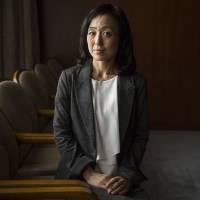 Mikari Kashima, head of the financial infrastructure studies division at the Bank of Japan, poses for a photograph at the central bank\'s headquarters in Tokyo on Sept. 13. | BLOOMBERG