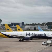 Monarch Airlines aircraft sit on the tarmac at Birmingham Airport in Birmingham, central England, Monday. | AFP-JIJI