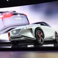Daniele Schillaci, Nissan Motor Co.\'s executive vice president, shows off the automaker\'s high-end concept EV Nissan IMx during a media preview at the Tokyo Motor Show on Wednesday. | YOSHIAKI MIURA