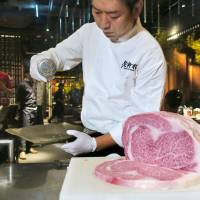 A chef prepares imported Miyazaki beef at a restaurant in Taipei on Saturday. The meat was part of the first beef shipment from Japan in 16 years after Taiwan lifted its 2001 import ban, which was triggered by an outbreak of mad cow disease. | KYODO