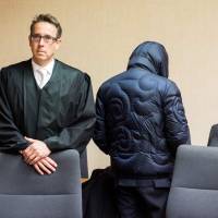 Former secret agent Werner Mauss (right) stands next to his lawyer, Daniel Fischer, at the start of a session of his trial in Bochum, Germany, on Thursday. | DPA / VIA AFP-JIJI