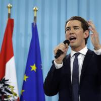 Austrian Foreign Minister Sebastian Kurz, head of the country\'s People\'s Party, speaks at an election party in Vienna on Sunday after polling stations closed. | AP