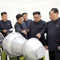 North Korean leader Kim Jong Un visits a nuclear weapons site in this photo released on Sept. 3. State-run media said Kim inspected the loading of a hydrogen bomb onto a new ICBM. | AP