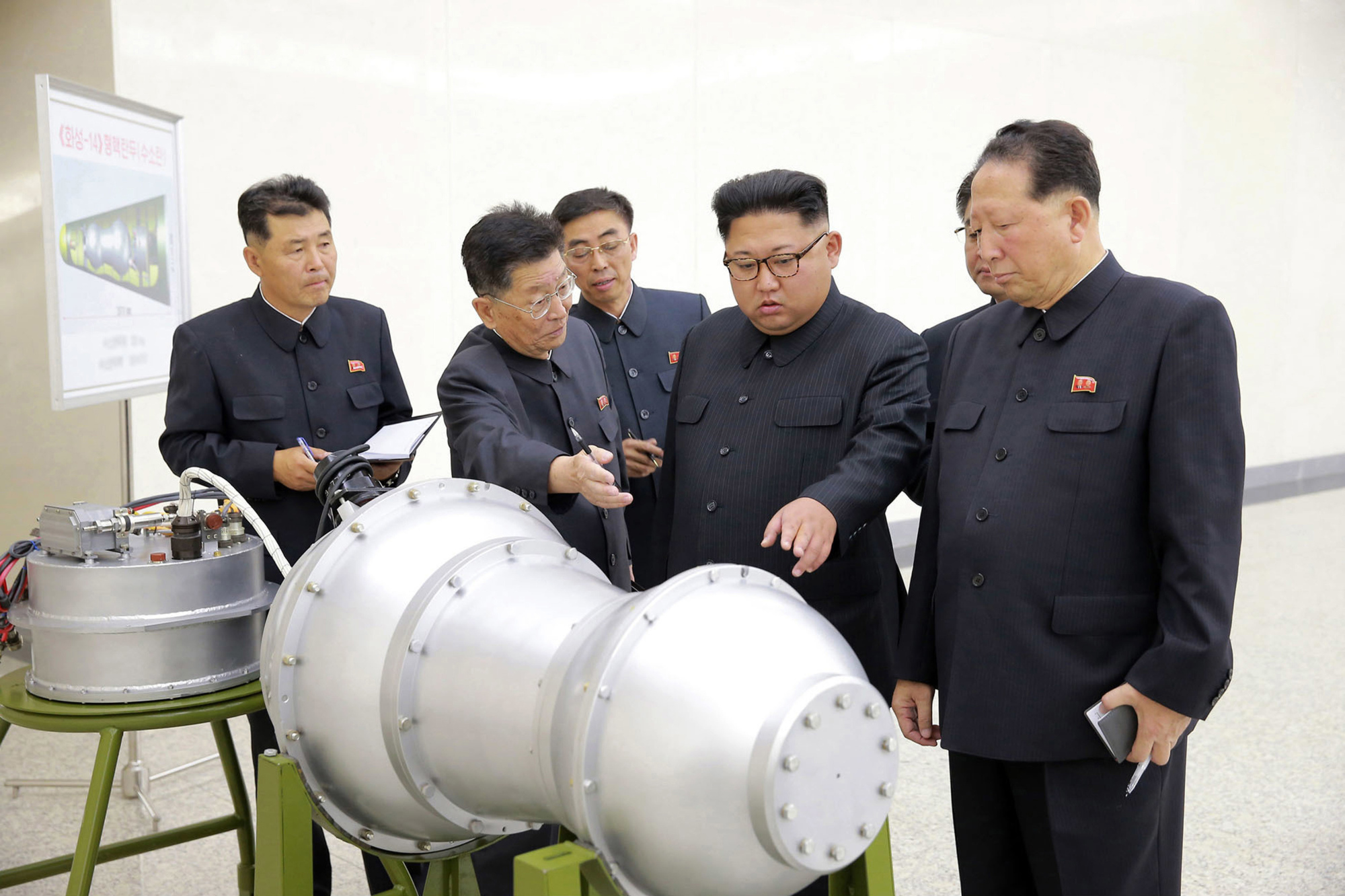 North Korean leader Kim Jong Un visits a nuclear weapons site in this photo released on Sept. 3. State-run media said Kim inspected the loading of a hydrogen bomb onto a new ICBM. | AP