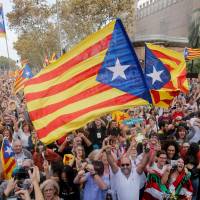 People celebrate after Catalonia\'s parliament voted to declare independence from Spain in Barcelona on Friday. | AFP-JIJI