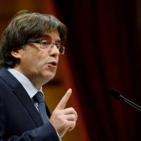Catalonia President Carles Puigdemont speaks during a session of the regional parliament in Barcelona, Spain, on Sept. 28. | REUTERS