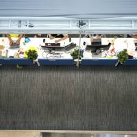 Employees work at computers inside the Beijing headquarters of ByteDance Technology Co., better known as Toutiao, a popular and fast-growing news feed app, in August. | BLOOMBERG