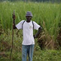 An ethnic Luo holds a spear after a standoff with Kalenjins near the Kenyan town of Muhoroni on Saturday. | REUTERS