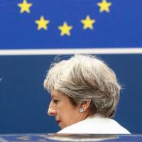 British Prime Minister Theresa May leaves a European leaders summit following two days of meetings in Brussels on Friday. | AFP-JIJI