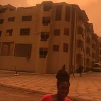 In this still image taken from social media on Saturday evening, people are seen running for cover following an explosion at a fuel distribution center in the Ghanaian capital, Accra. | LOIS KORANTEN VIA REUTERS