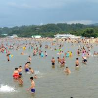 People swim at Songdowon International Children\'s Camp in Wonsan, North Korea, in this undated photo. | REUTERS
