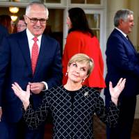 Australian Prime Minister Malcolm Turnbull watches as Foreign Minister Julie Bishop reacts after an official ceremony to swear in members of the government in Canberra in July 2016. | REUTERS